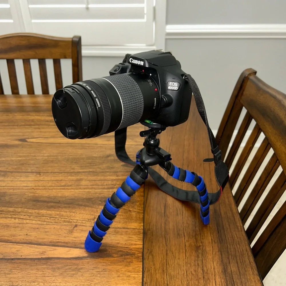 Canon EOS 4000D DSLR Camera with Black and Blue Gear